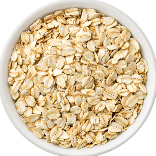 Bowl filled with uncooked rolled oats
