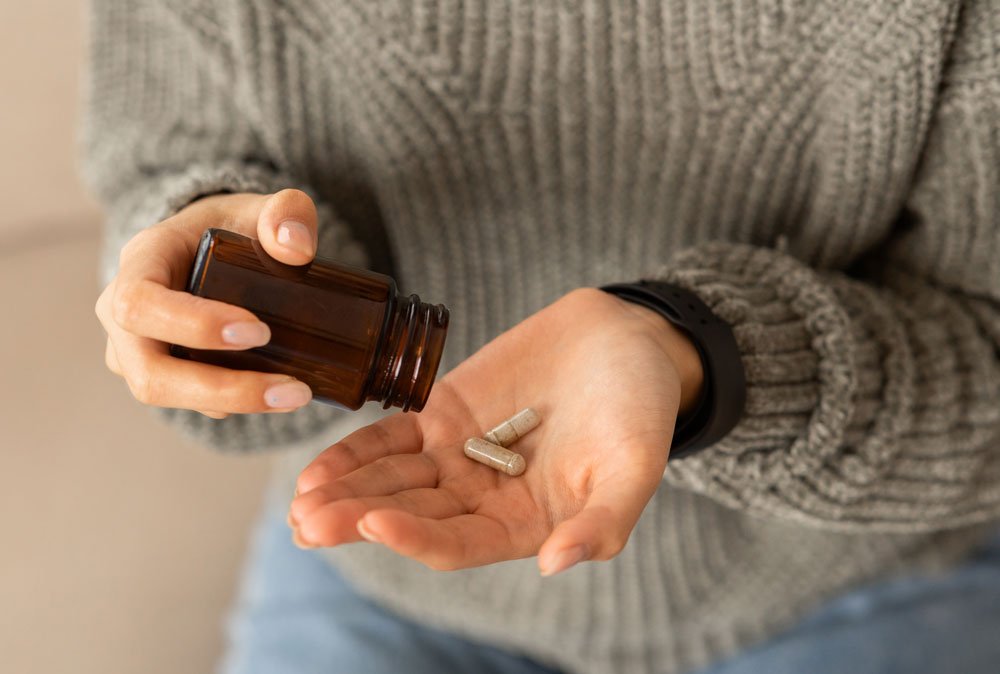 Holding vitamin supplement capsules