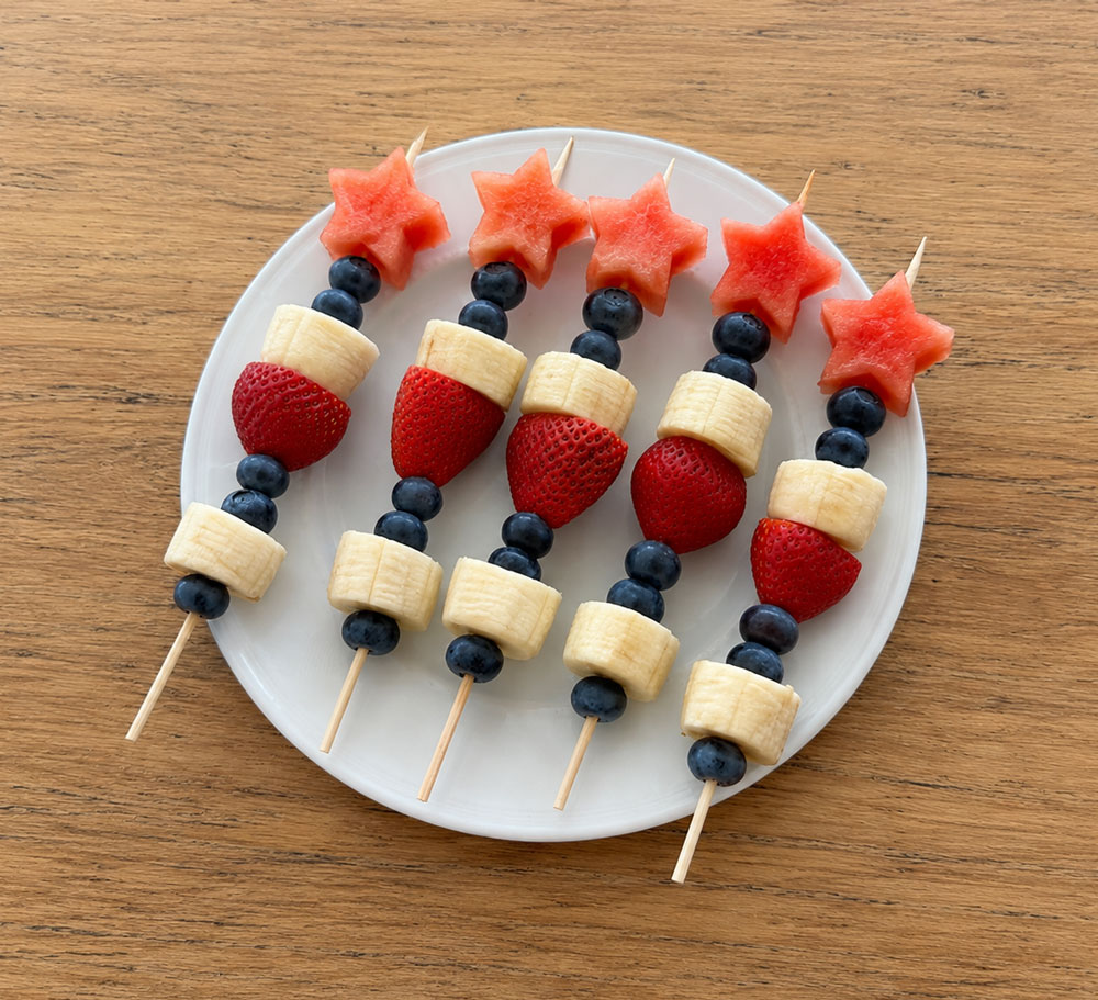 Fruit skewers with watermelon stars, berries, and banana
