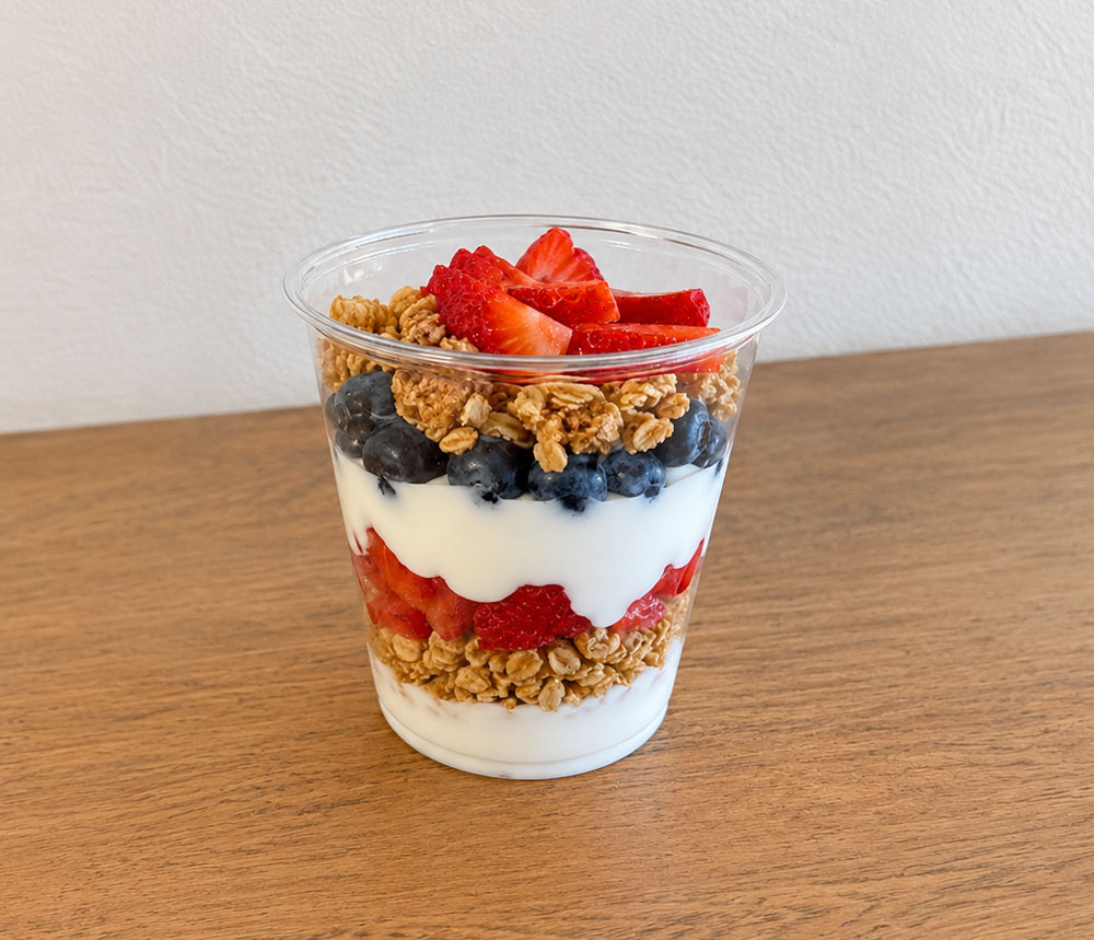Yogurt parfait with berries and granola in cup