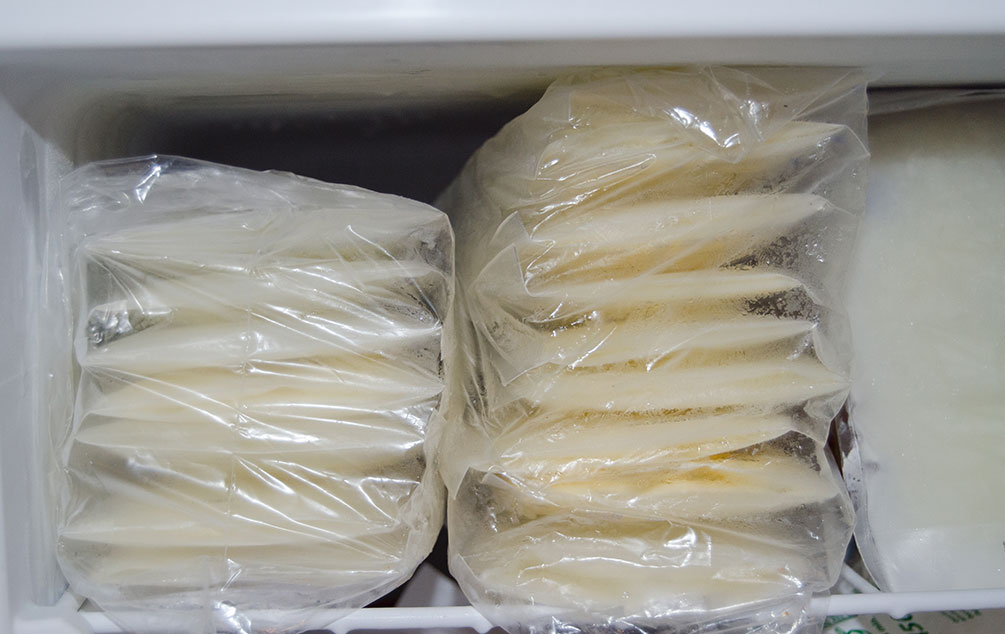 Frozen breast milk stored in sealed plastic bags.