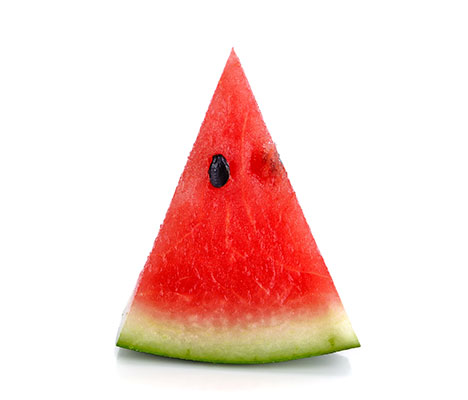 Watermelon wedge standing upright with visible seed