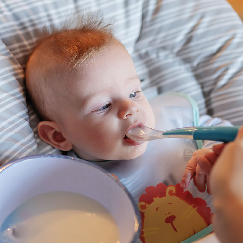 Baby-Being-FedInHichair